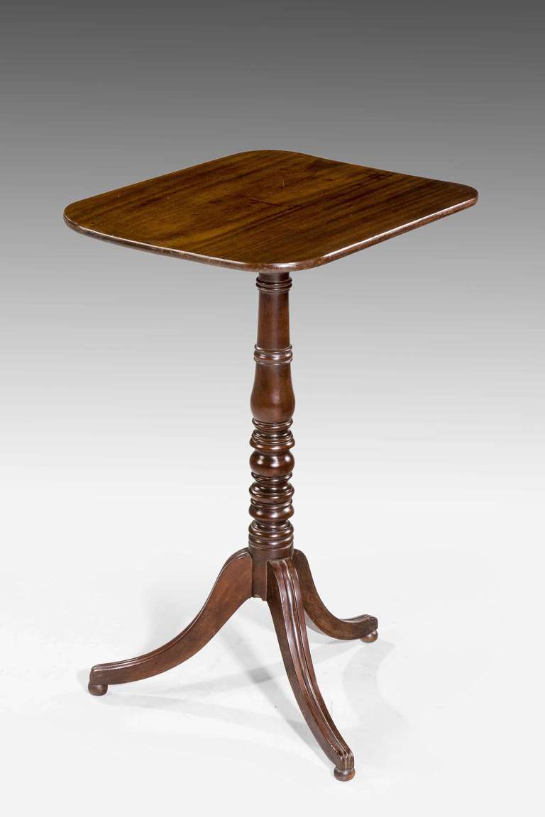 An attractive George III period mahogany tilt table, finely figured top over a well turned baluster support with three high swept legs.


