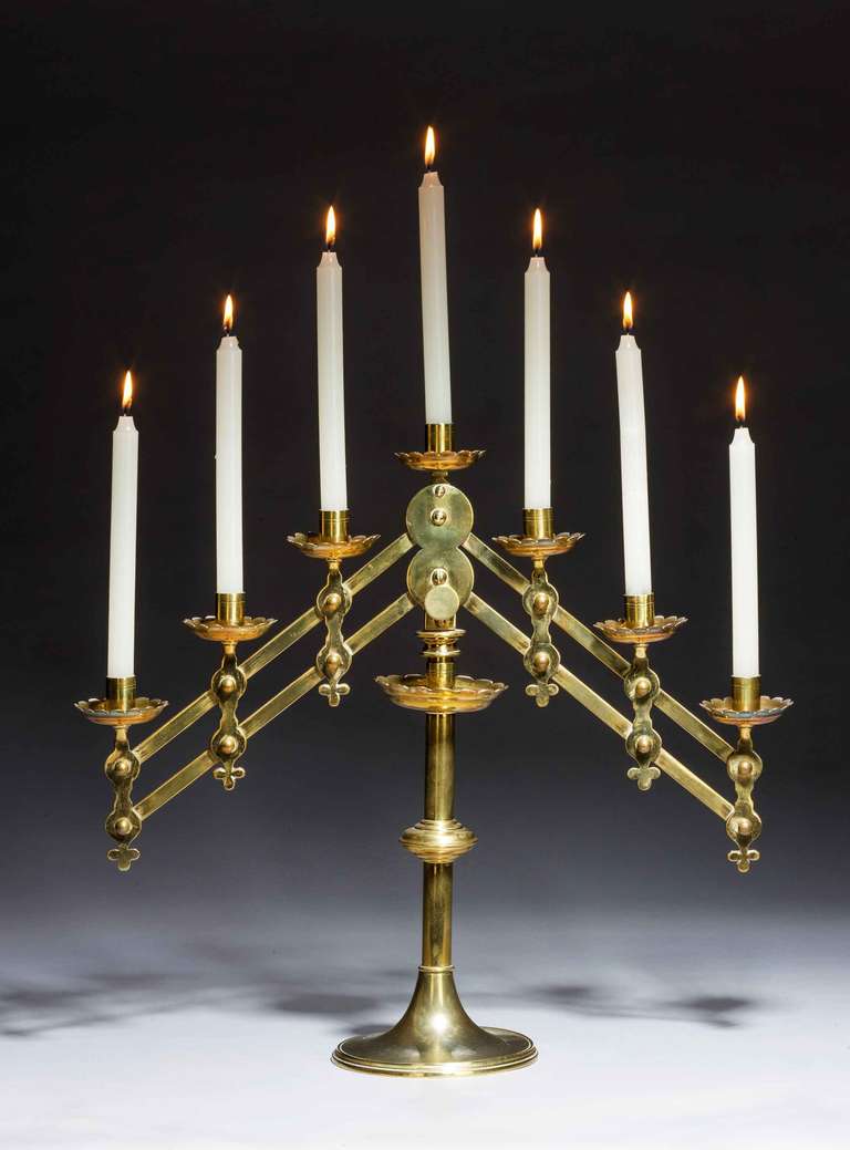 19th century adjustable brass menorah candelabra. 

Provenance:
One of the oldest symbols of the Jewish faith is the Menorah, a seven-branched candelabrum used in the Temple. The kohanim lit the menorah in the Sanctuary every evening and cleaned