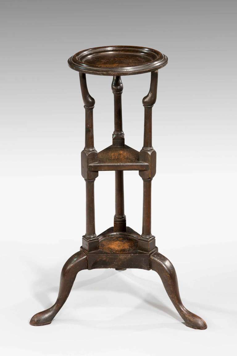 18th century George III period oak wig stand, the triform supports with shelves on pad feet, the surface now somewhat tired and heavily patinated.

RR.
