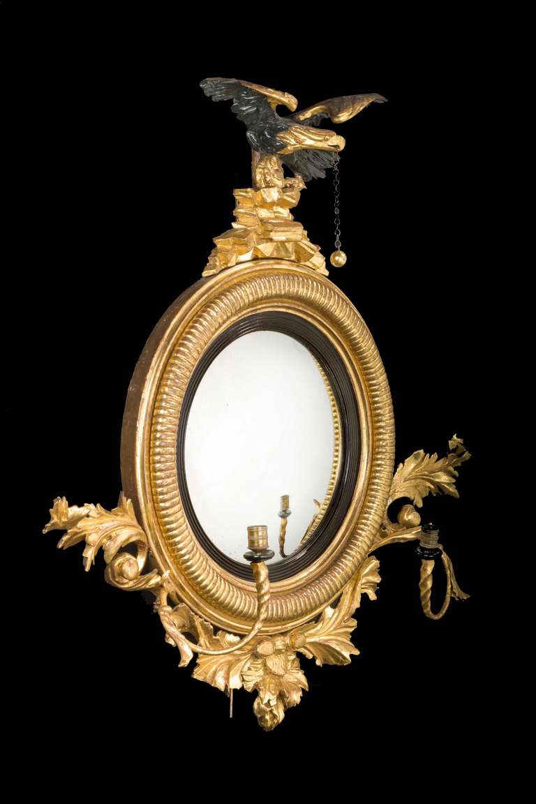 English Regency Period Convex Mirror with a Rocaille Pediment Surmounted with an Eagle