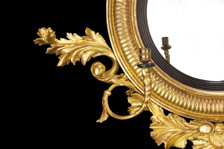 19th Century Regency Period Convex Mirror with a Rocaille Pediment Surmounted with an Eagle