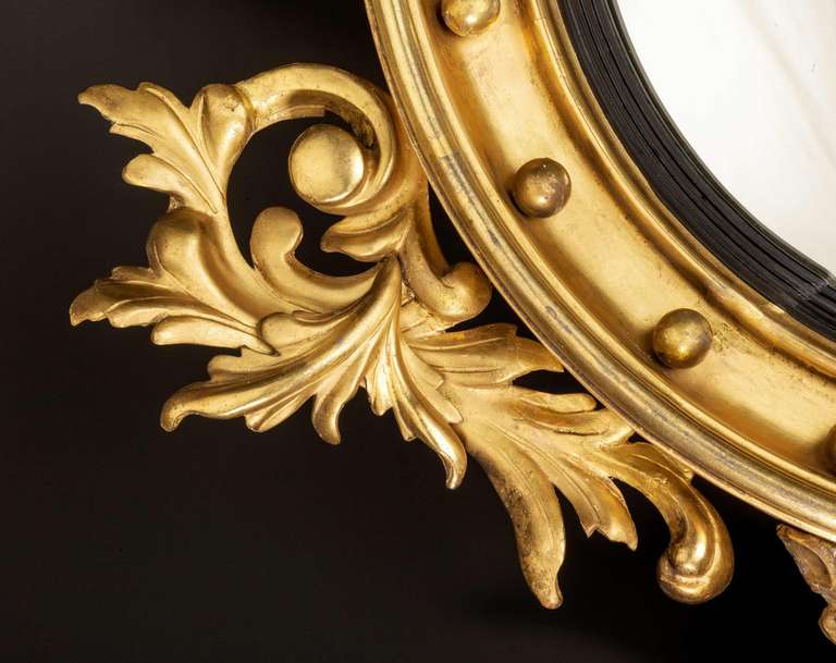 19th Century Regency Period Convex Mirror with Carved Foliage and Eagle
