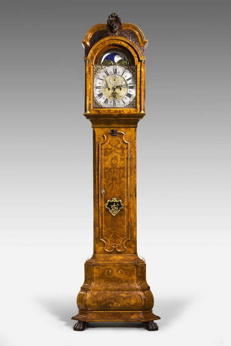 Early 18th century walnut longcase clock by Johannes Elias of Amsterdam, showing phases of the moon within the arch, date and hygrometer lenticle, very well figured case.

RR.