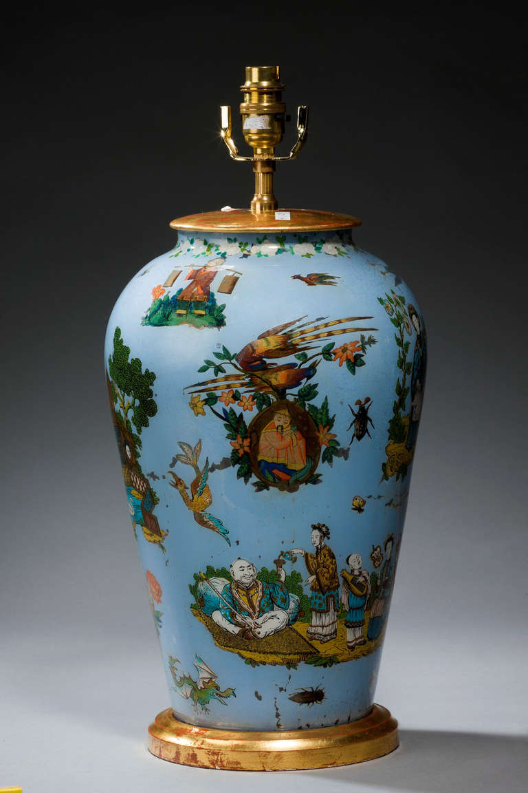 1920s decalcomania vase now converted into a lamp, with exotic oriental figures and landscapes, 20th century.

Decalcomania, from the French décalcomanie, is a decorative technique by which engravings and prints may be transferred to pottery or