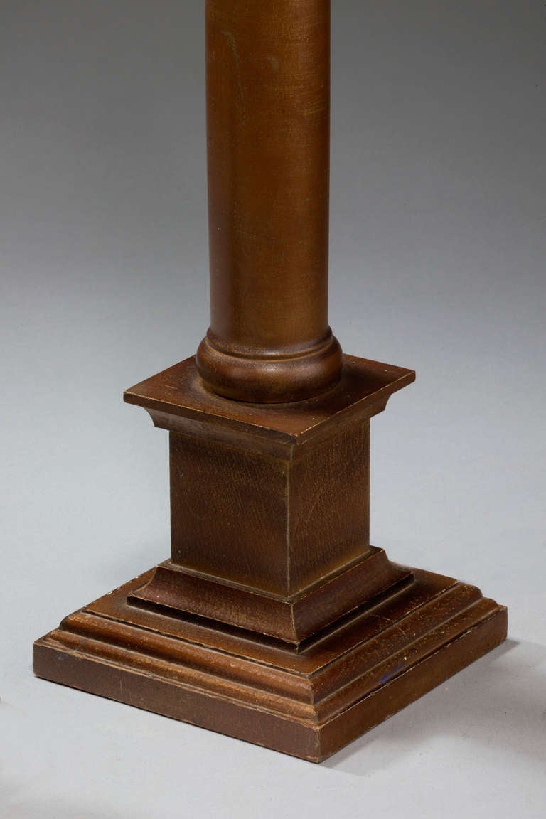 Pair of carved wood column lamps with bronze finish.
