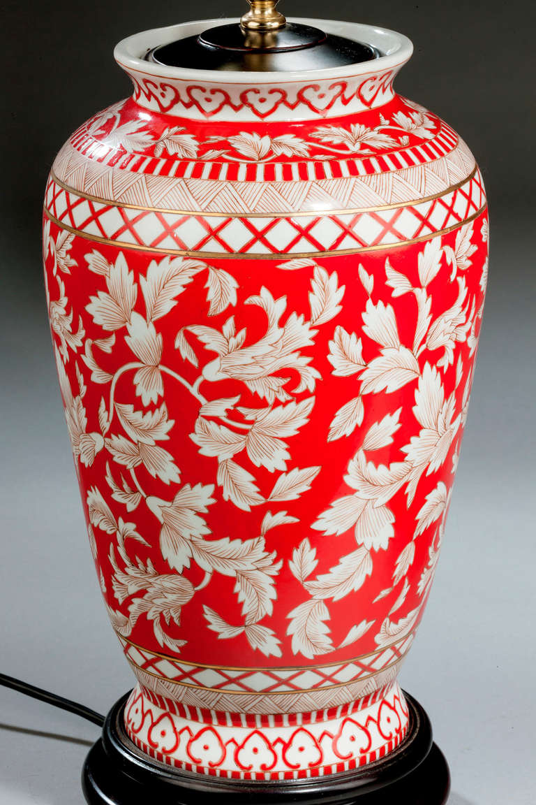 Pair of large porcelain lamps with red ground and foliage decoration. Modern.

RR.