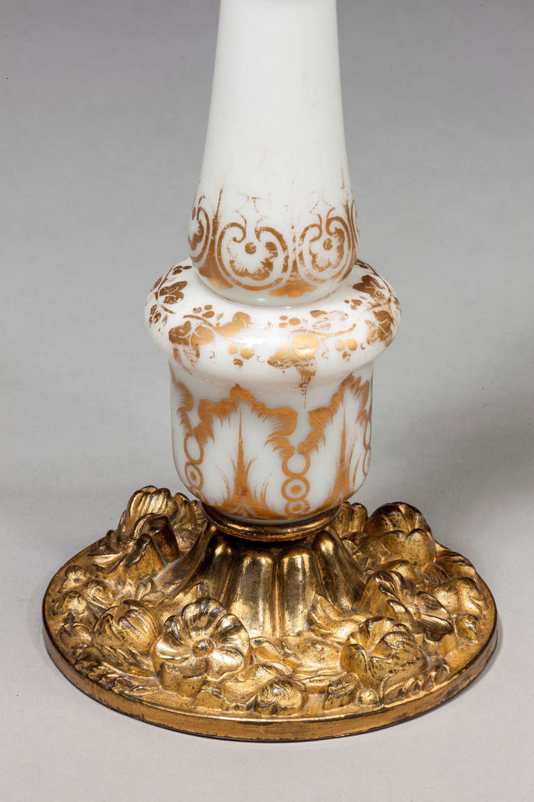 French opaline glass column lamp, with gilded decoration on a finely cast gilt bronze base.

Shades are not included in the price of our lamps. We do have a competitively priced range of shades for all of our lamps. Please ask for details with your