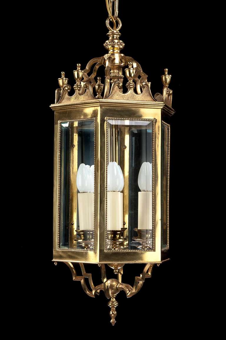 A good quality and beautifully cast gilt bronze lantern, the bevel glass panels over shaped base, the top section with swan neck pediments and acorn finials.

RR.