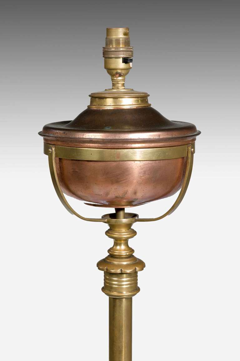 A Standard brass Oil Lamp, now for electricity, on tri-form scroll supports.

Shades are not included in the price of our lamps. We do have a competitively priced range of shades for all of our lamps. Please ask for details with your inquiry or