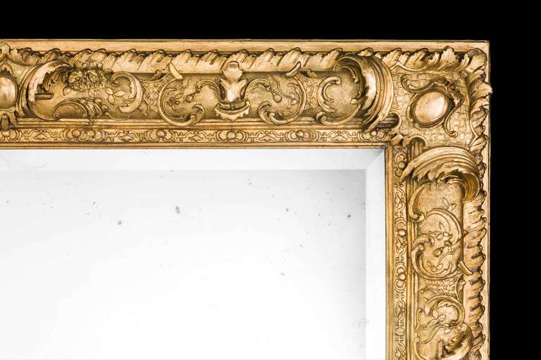 A very good 19th century giltwood rectangular mirror, which can be hung landscape or portrait with pronounced scrolls, leaves, hatching and foliage in excellent condition, the gilding now a little tired in places.

RR.