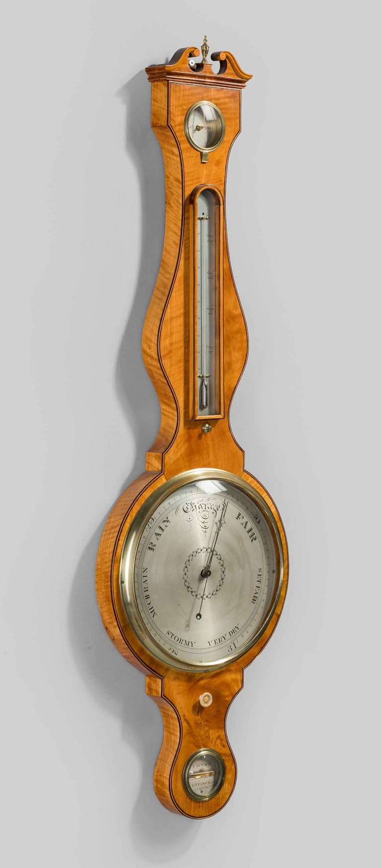 Fine quality and very attractive George III period 10 ins wheel barometer by Vecchio of Nottingham having silvered thermometer, hygrometer, spirit level and dial all in a satinwood case with a swan neck pediment with brass finial to top. Boxwood and