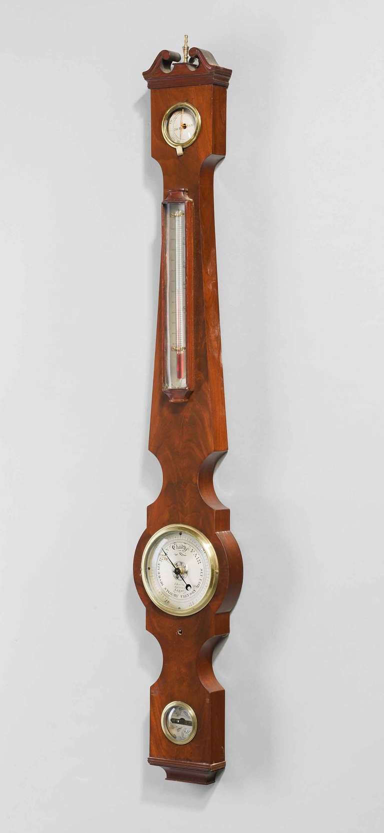 A fine late Regency period mahogany 4 ins dial barometer by I.Davis of Leeds Yorkshire, silvered dial, thermometer, hygrometer, spirit level, having a swan neck pediment with a brass finial.

Maker I Davis optician Leeds Yorkshire. 

Possibly