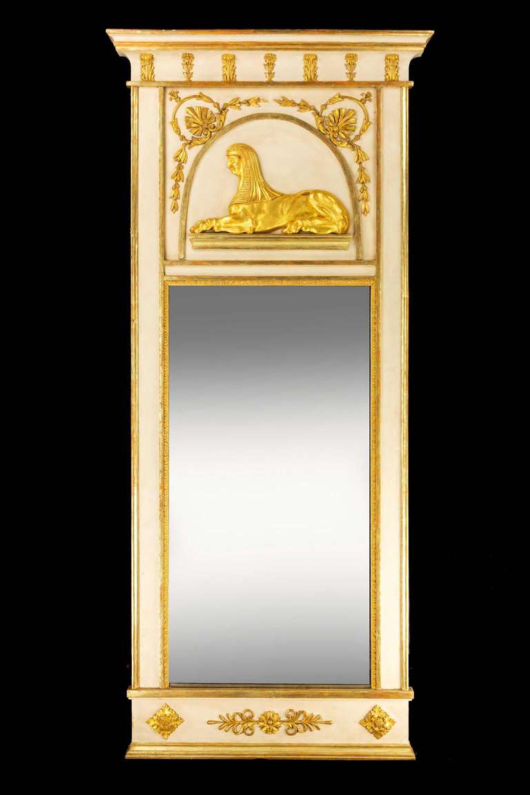 A good North European parcel gilt Mirror, the top section with a well carved sphinx within a frame work of garlands and wreaths and stylised anthemia. Early 19th century.

RR
