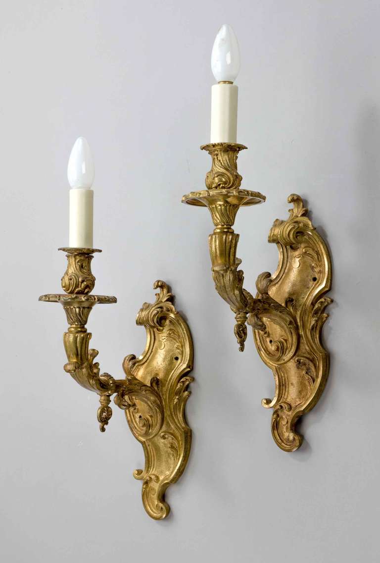 A pair of Late 19th Century well cast single arm gilt bronze Wall Lights, very sympathetic with #6201 and originally from the same room.

