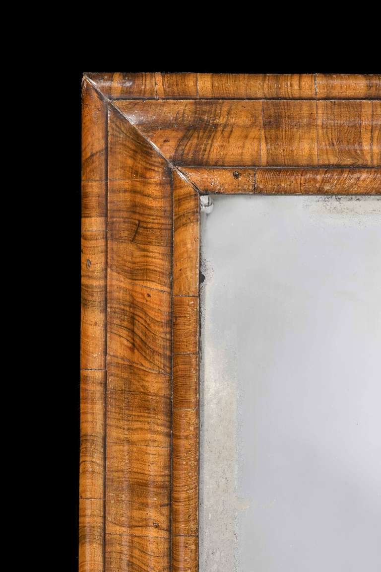 A good 18th Century Laburnum Cushion Mirror, the triple section moulded frame entirely veneered on the cross.

RR