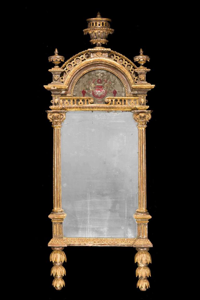 Good 18th century Italian parcel-gilt pier mirror, the surfaces and plate original but now a little tired. Elaborate columns with a drop base section, the top arched section very well engraved.