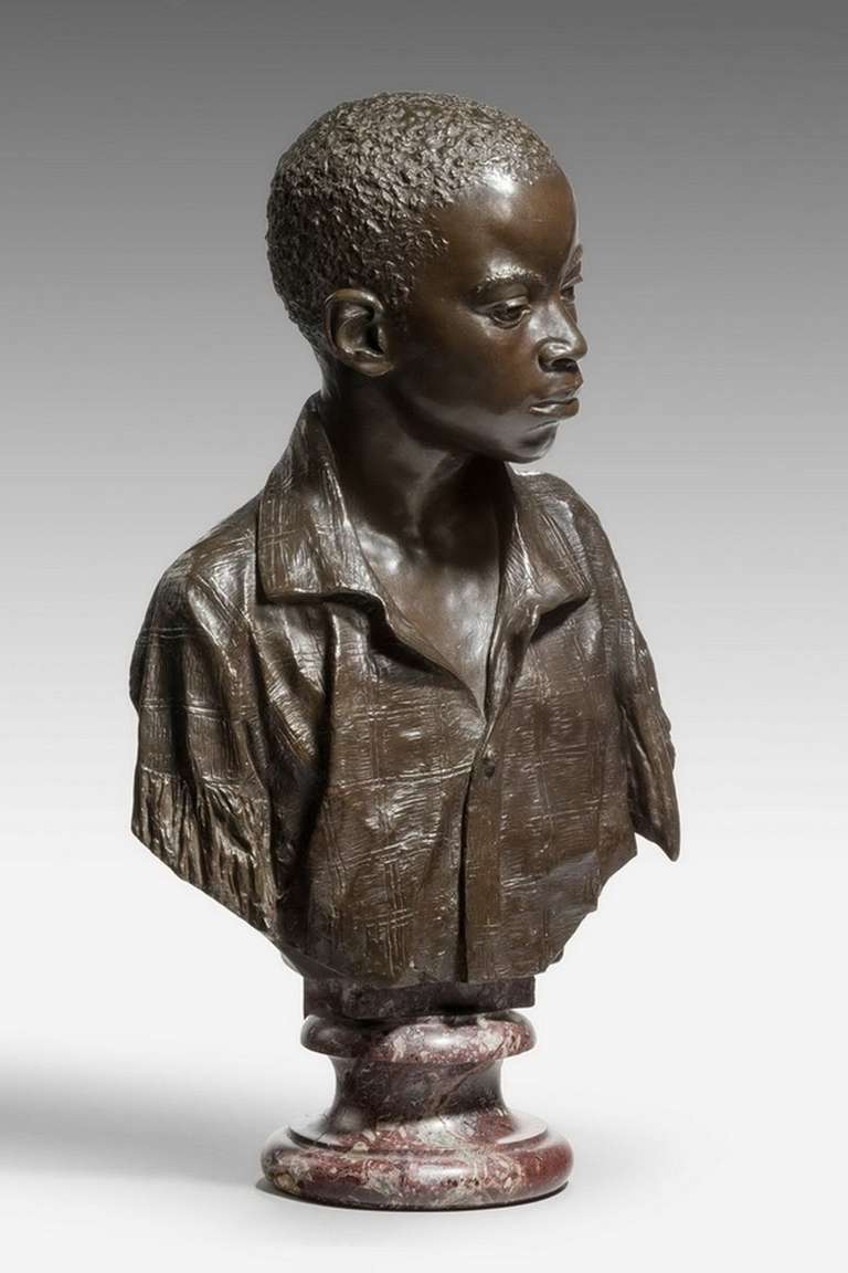 A superb 19th century modelled bust of a Negro, dark brown patina in original condition on a circular socle. Signed Phinney. Roma. Dated 1878. 

Emma Elisabeth Phinney. Phinney was in Rome studying sculpture when she carved Lorelei from a block of