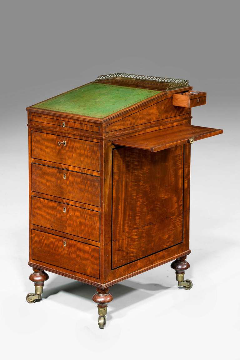 A good Regency period mahogany Davenport desk of sophisticated form, the beautifully figured timbers with ebony line inlay incorporating a slide

Provenance
A Davenport, (sometimes originally known as a Devonport desk) is a small desk with an