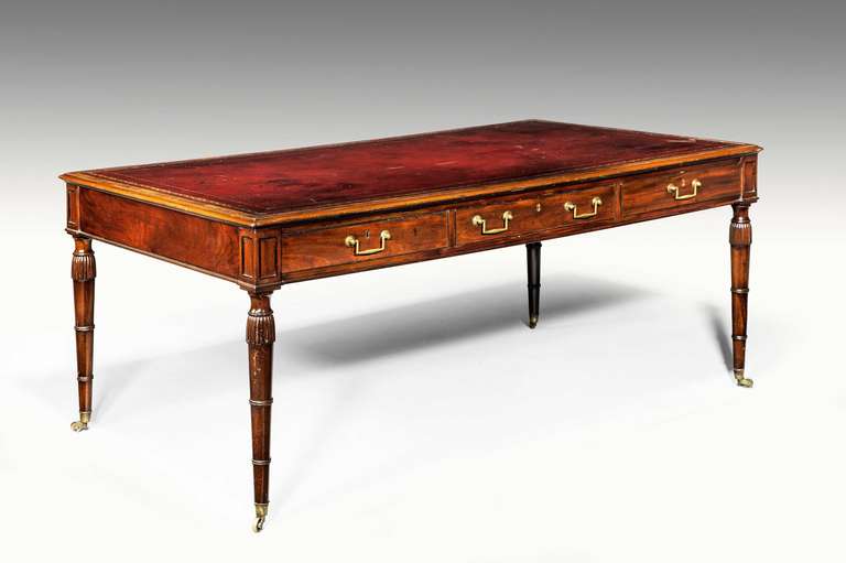 Large six-drawer writing table by Gillows of Lancaster with fluted turned legs terminating in castors.

Provenance:
Robert Gillow (2 August 1704 – 1772) was an English furniture manufacturer.
Born in Singleton, Lancashire he served an