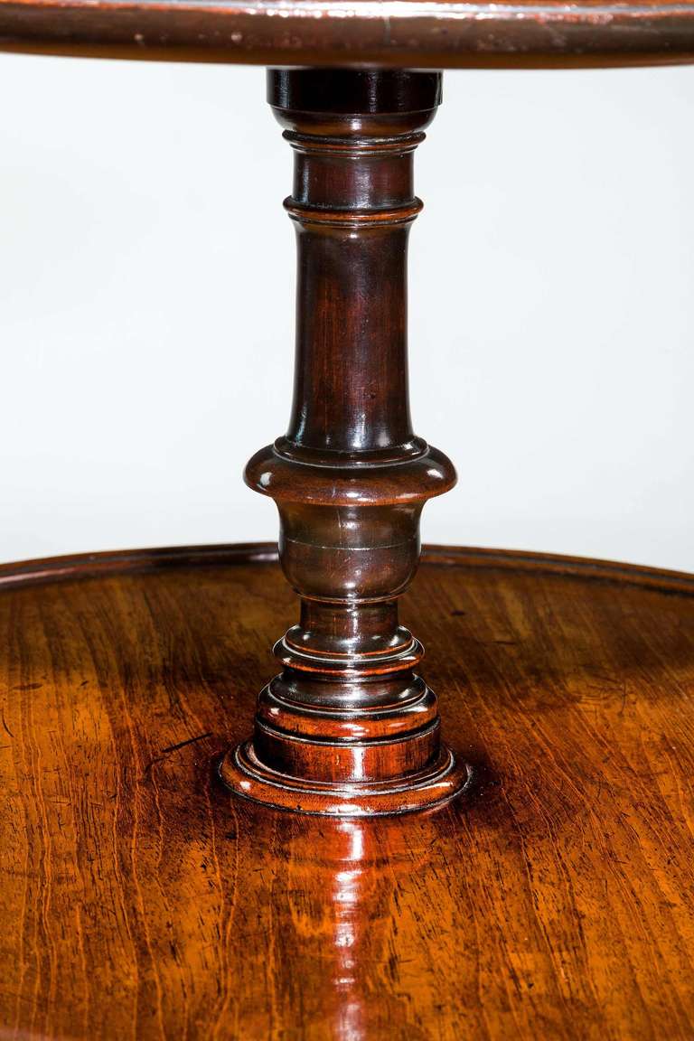 A quite exceptional Chippendale period mahogany dumb waiter, the lightly dished tops with a finely carved centre stem, the supports with finely carved scrolling foliage terminating in a scroll foot.

RR.