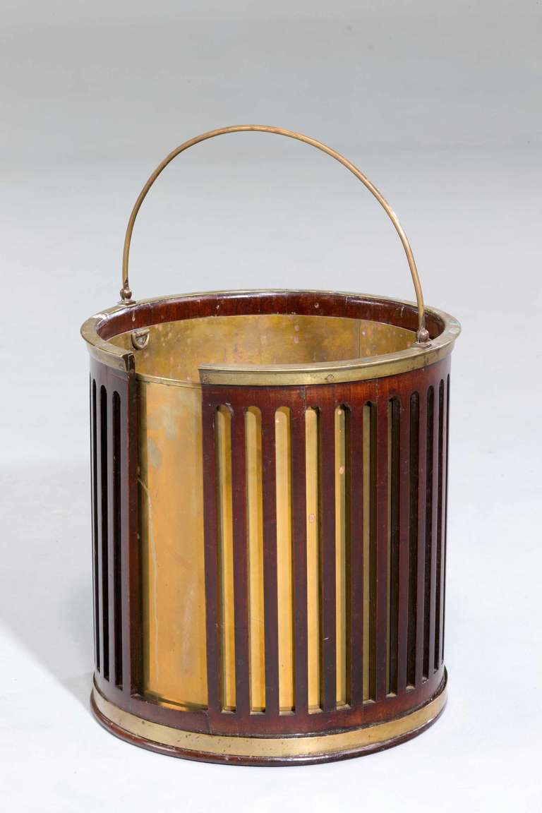 A George III period mahogany plate-bucket now with a fitted brass liner, the bucket last quarter of the 18th century.