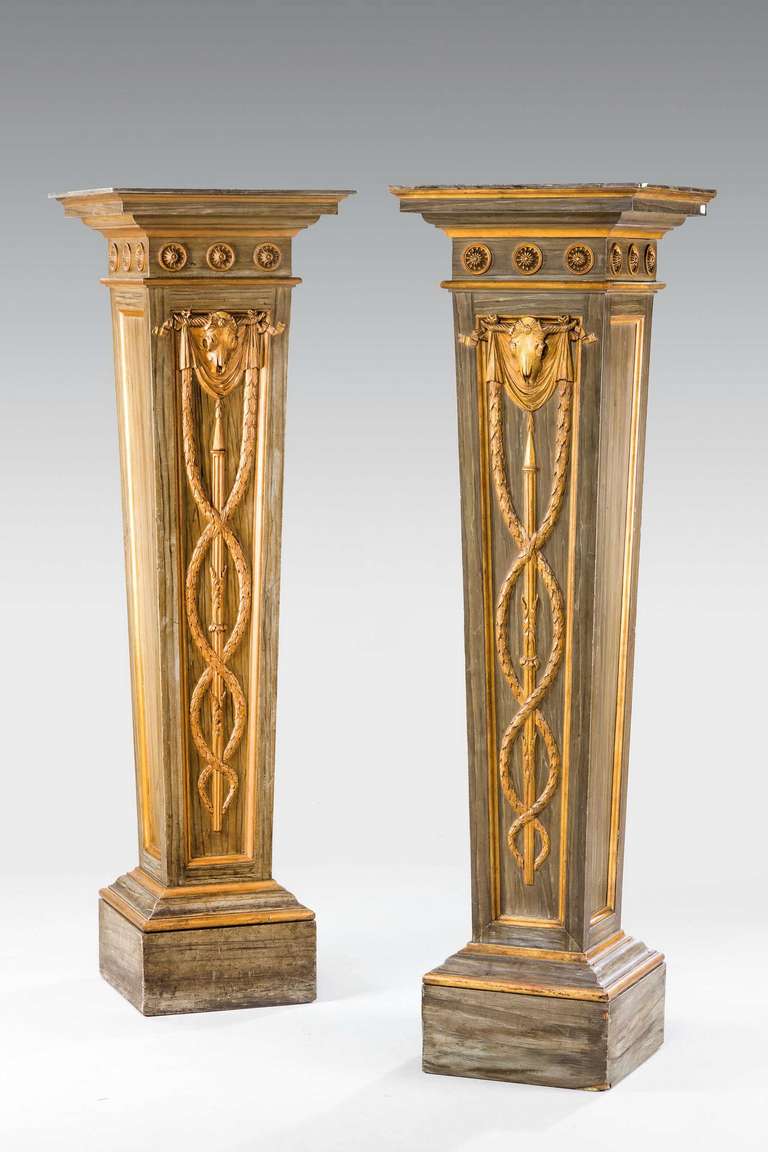 A good pair of George III period parcel gilt pedestals, the finely carved decoration of drapes and swags.