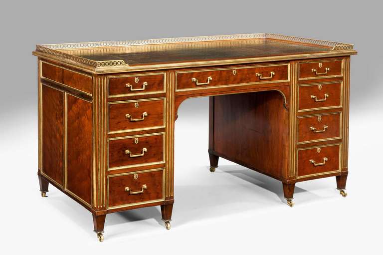 Gillows of Lancaster, a fine mahogany pedestal desk in the French taste with gilt bronze gallery and indented ferrules the reverse incorporating a pair of cupboards, the whole of quite extraordinary fine cabinet work typical of the very best of