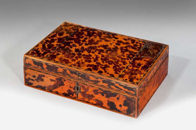19th Century Tortoise shell fitted Box, the interior with six lidded compartments, the exterior with ebony and boxwood stringing.
