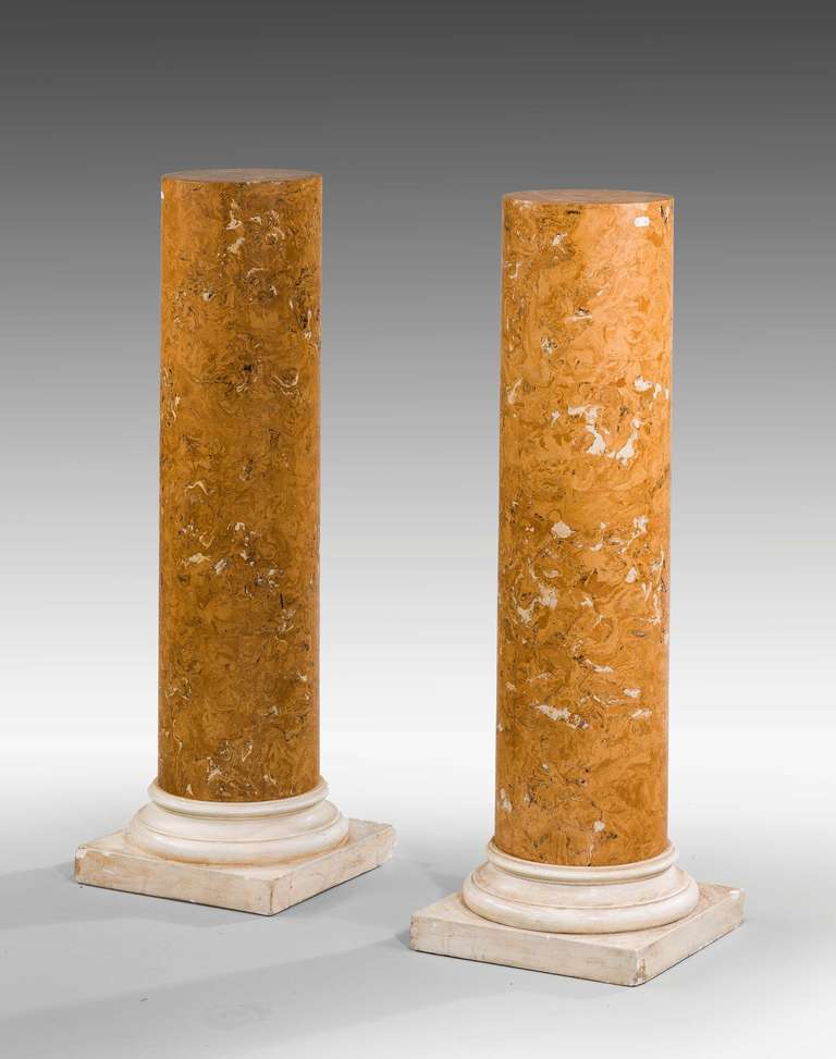 A good pair of Regency period Scagliola simulated marble pedestals of simple outline on turned and square section bases.

Provenance:
Scagliola (from the Italian Scaglia, meaning 