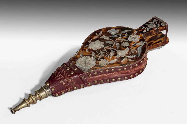 A most attractive set of 19th century tortoiseshell bellows. The face side with beautifully engraved mother-of-pearl floral and foliage decoration. The reverse side plain tortoiseshell.


