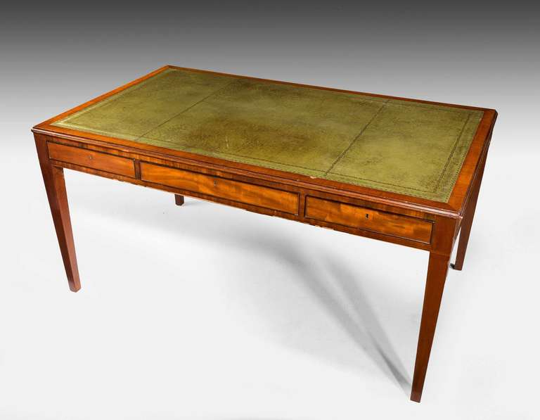 Regency period mahogany Six drawer Writing table with inset leather surface, the whole standing on square tapering supports.