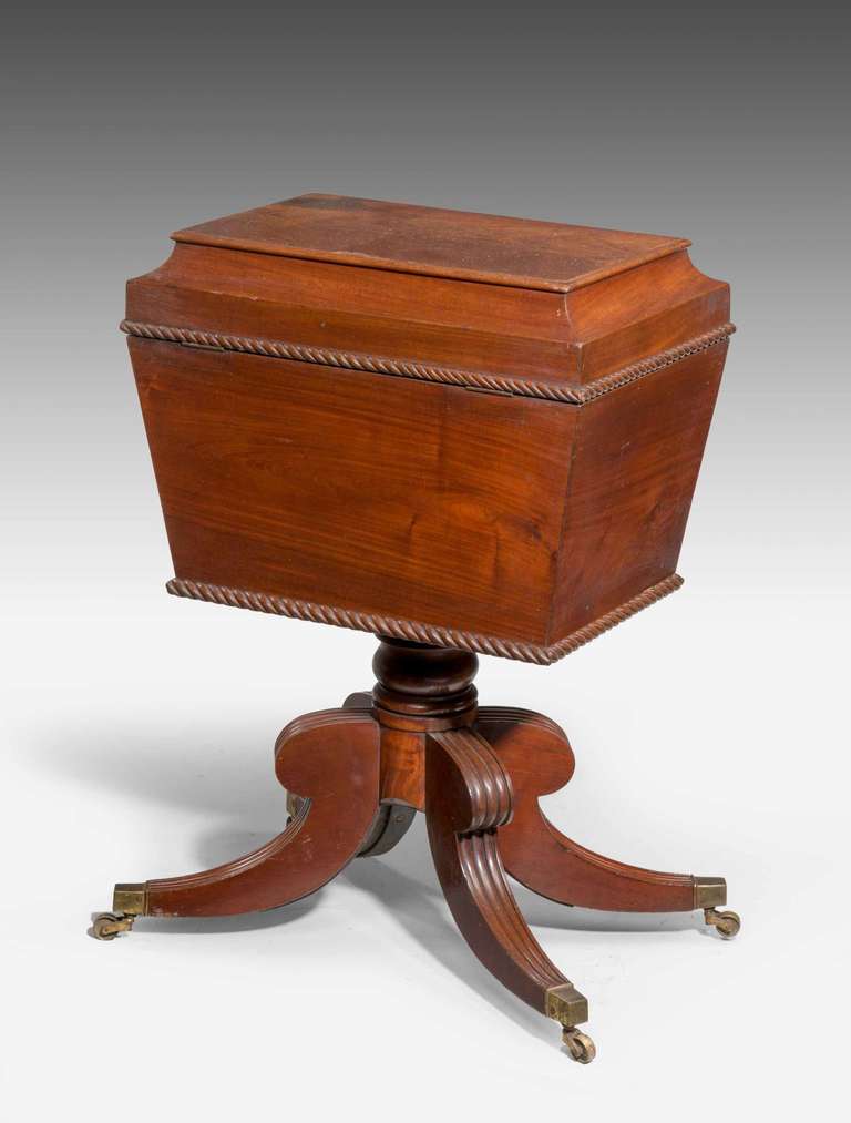 An elegant Regency period mahogany Sewing Box on swept reeded and hipped supports, the two edges with continuous rope carving.