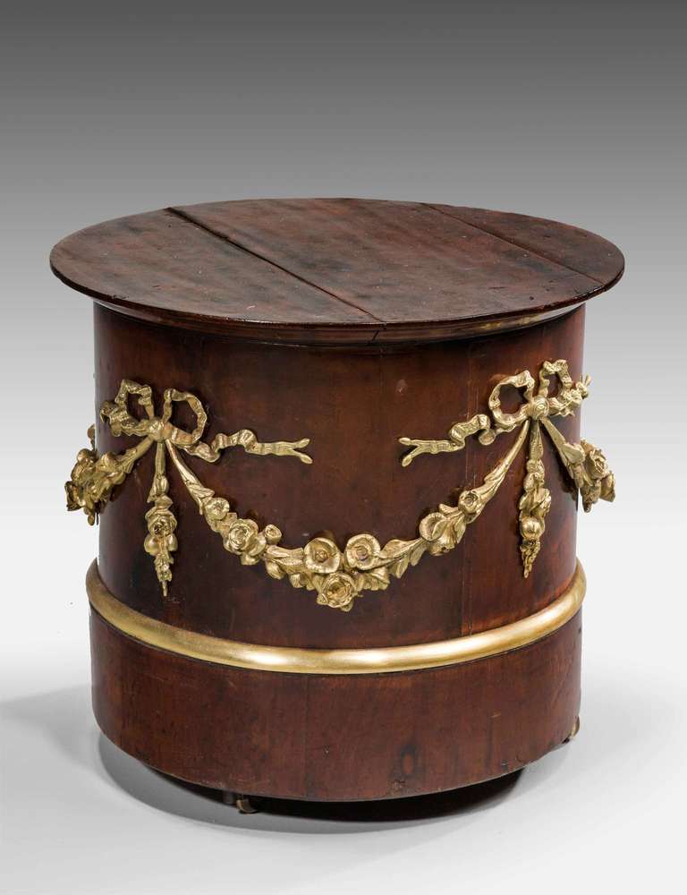 19th Century French mahogany Plinth on castors, finely cast continuous border of gilt bronze garlands and flowers.