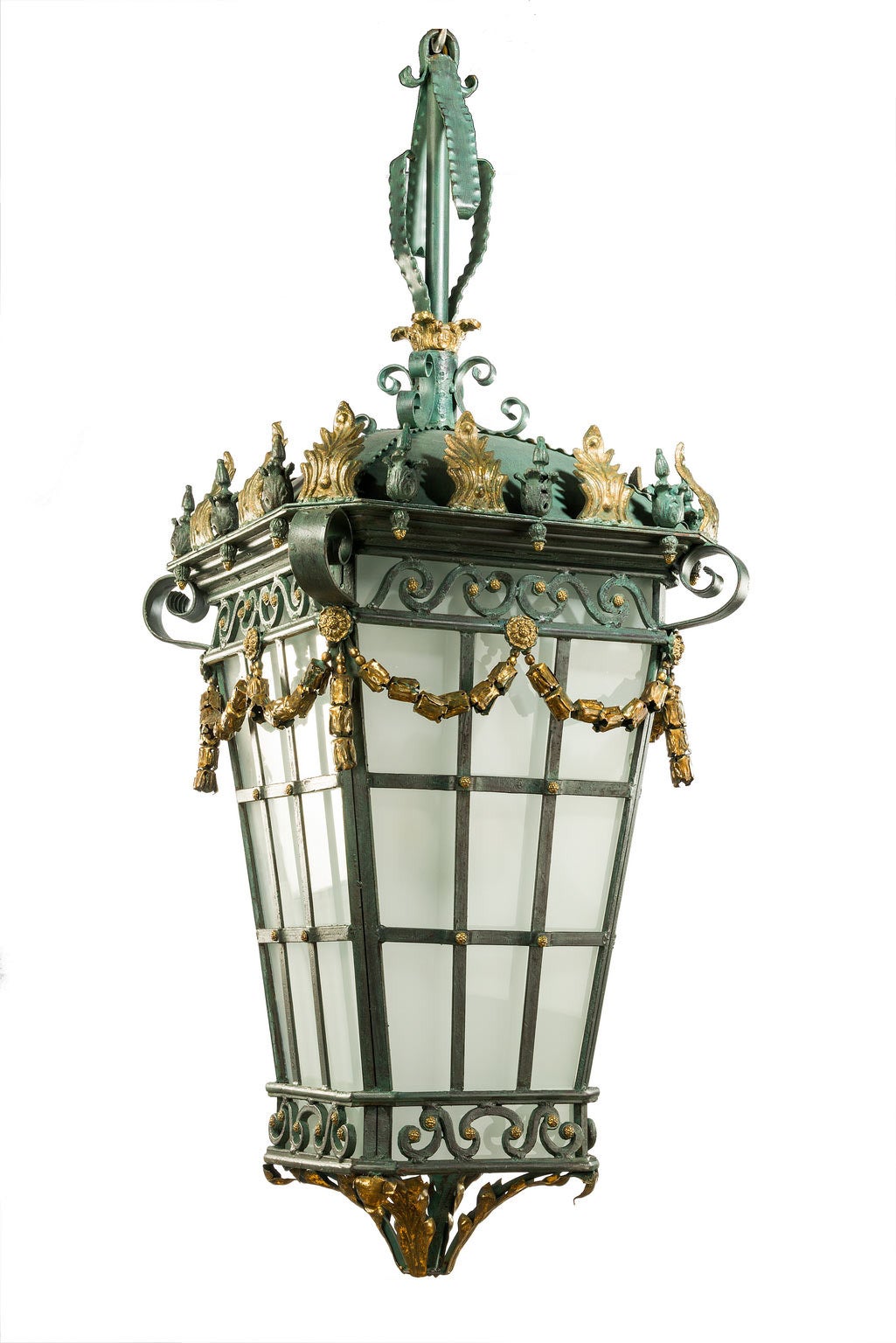 A massive patinated bronze lantern, the upper framework with scrolls and swags and flared leaf decoration.

RR.