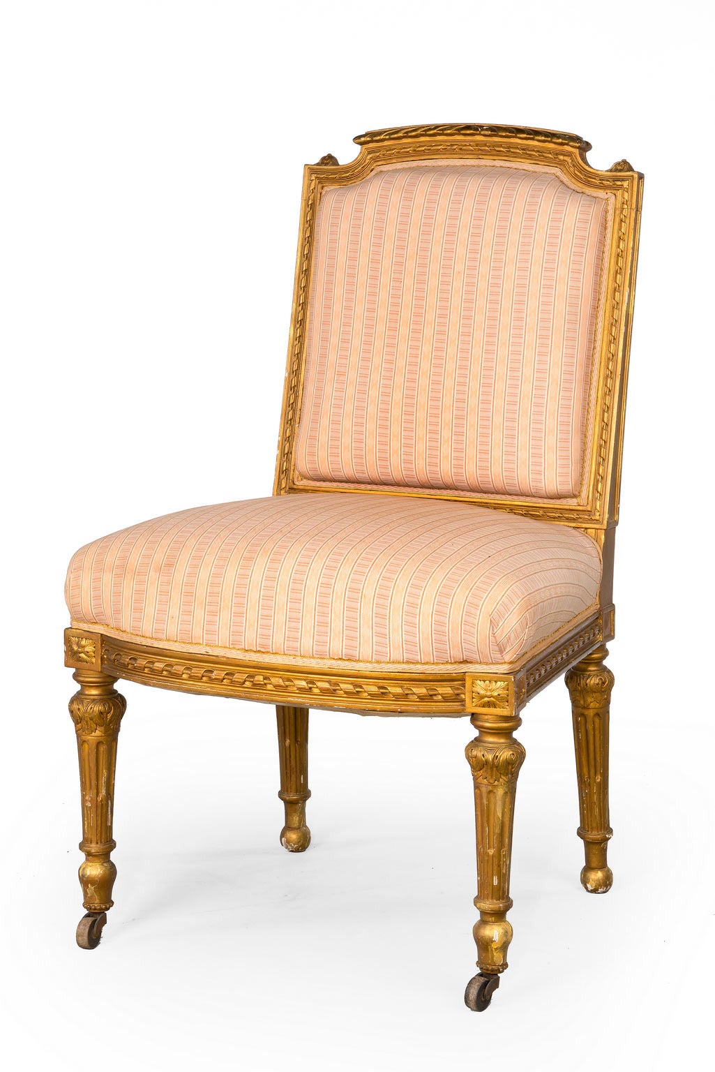 A Pair of Gilt Wood Single Chairs with Bow front rails incorporating Victorian scrolls, turned and reeded supports. The gilding replaced and now patinated.
