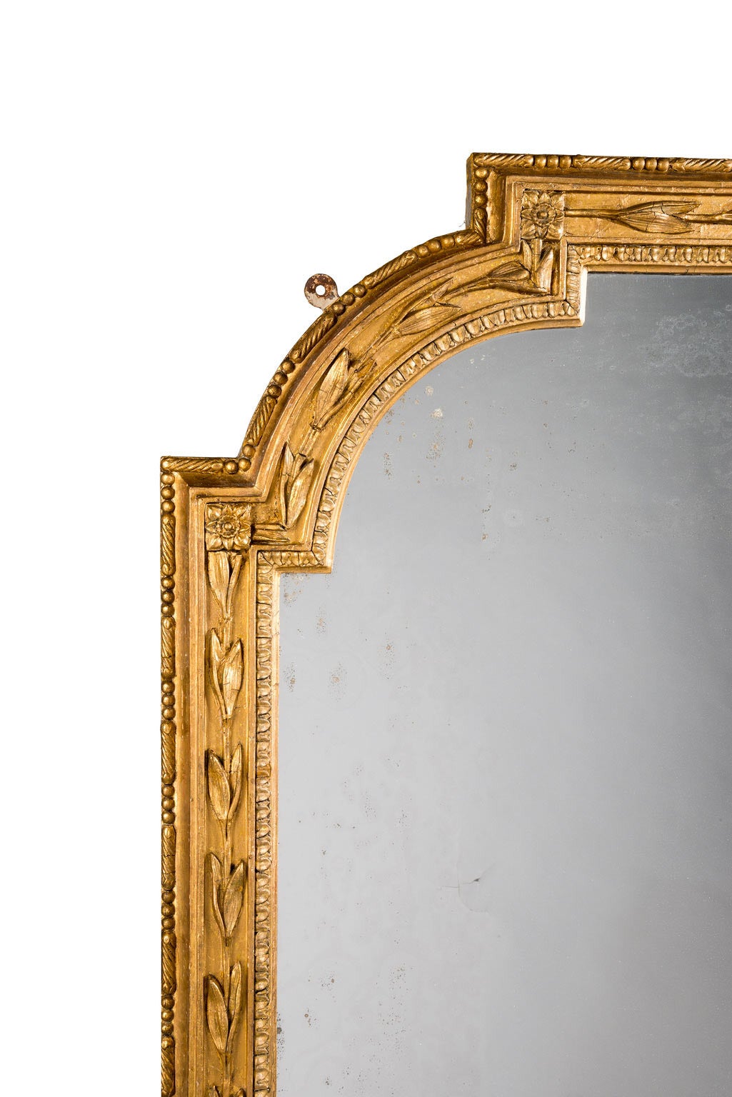 A fine quality large over mantel Mirror with a Period Plate. The shaped surround with continuous carved details of leaves. Fine gilding somewhat restored but beautifully highlighted.