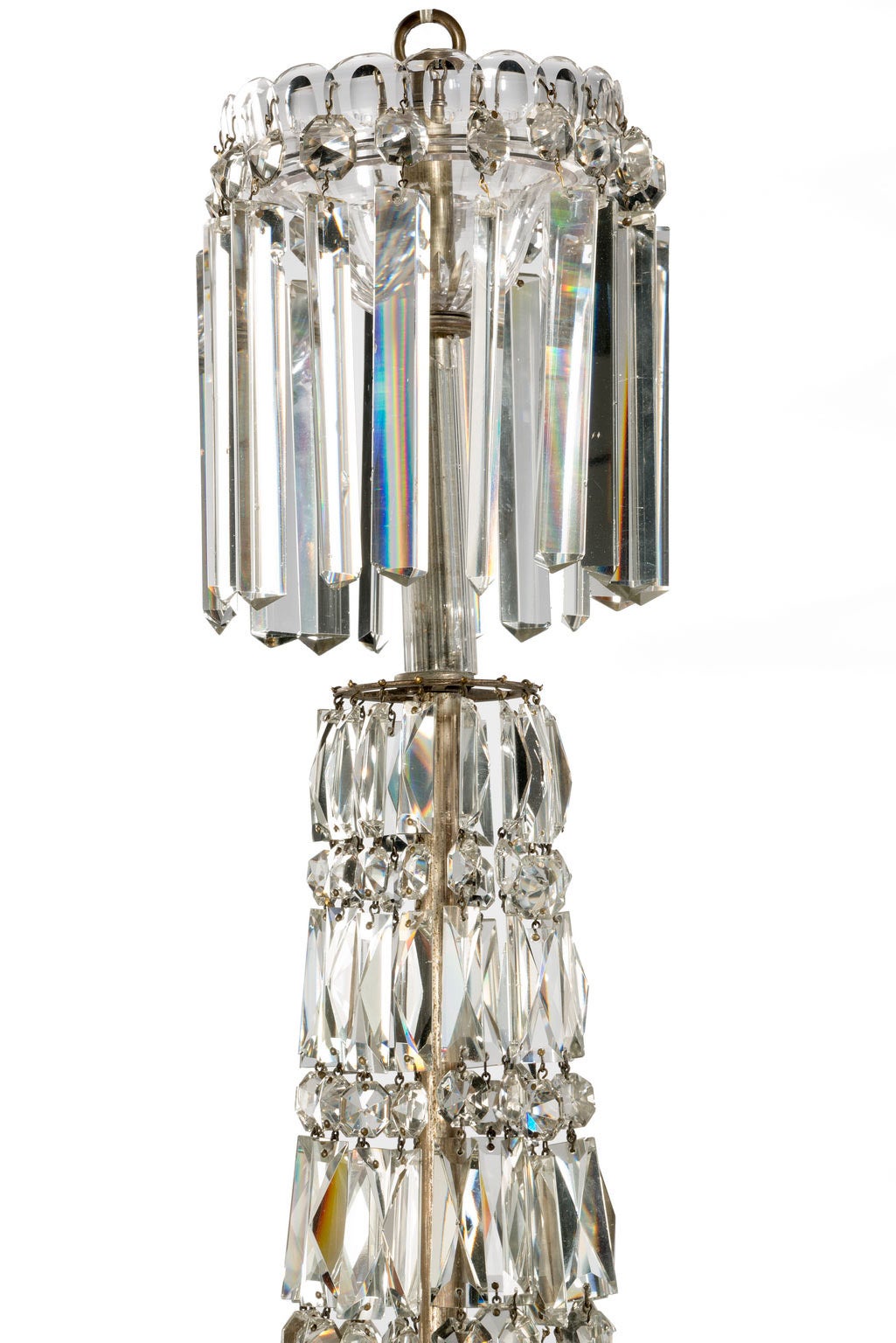 A mid-19th century three-arm crystal chandelier of usually slender form. The long plasmatic drops with a central section of fourchette cutted and button drops.

RR.
