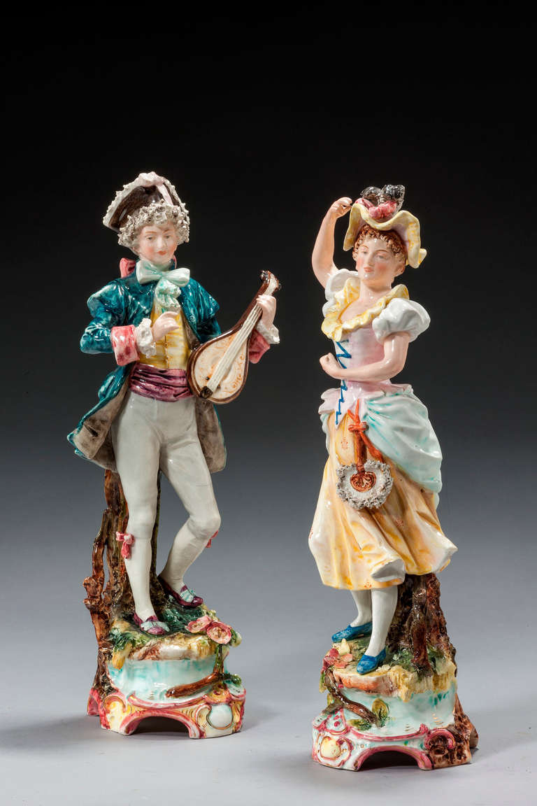 Pair of Continental pottery figures of a lute player and a young dancing girl.