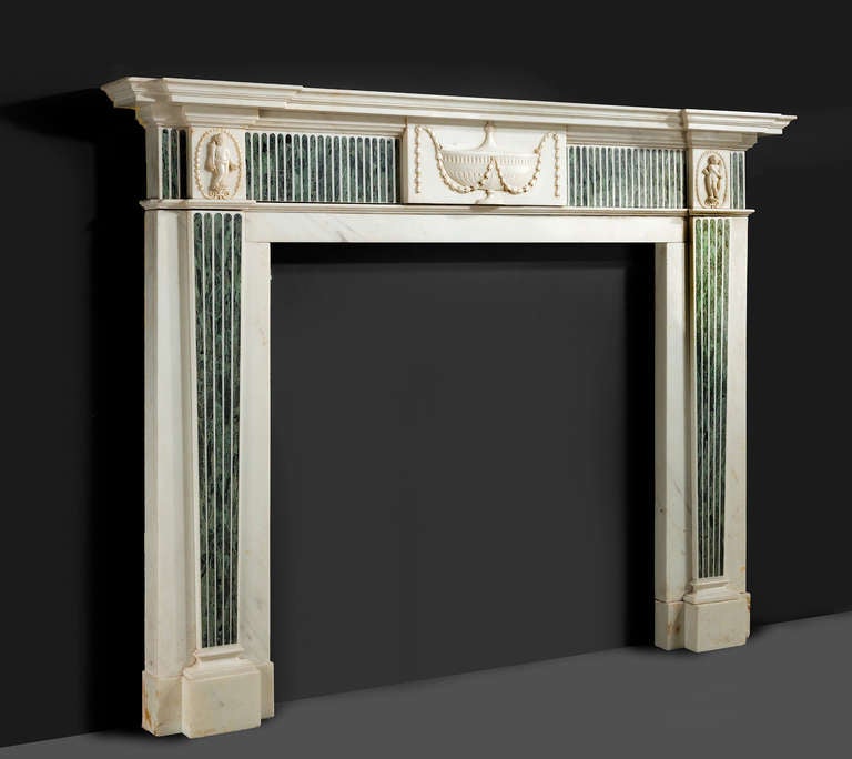 A fine George III period neoclassical marble fireplace with finely carved details to the central tablet and the upper joins.