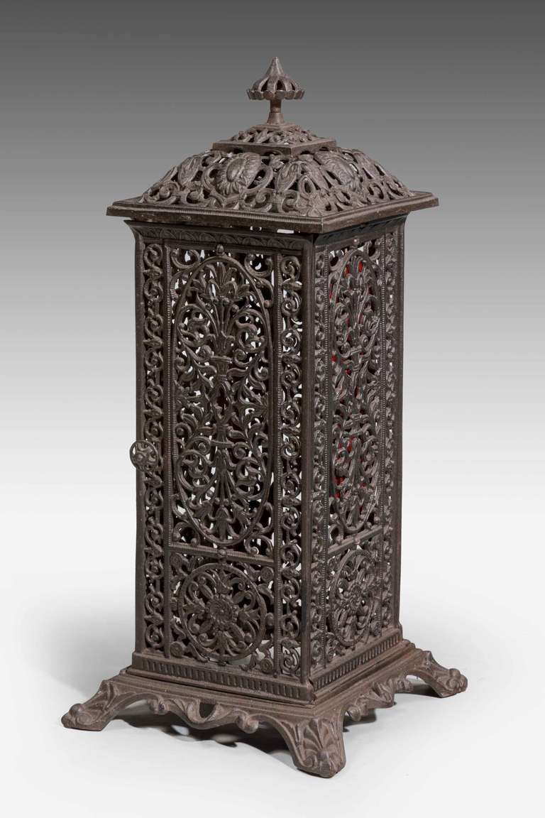 Mid-19th century cast iron heater frame. No internal fittings.