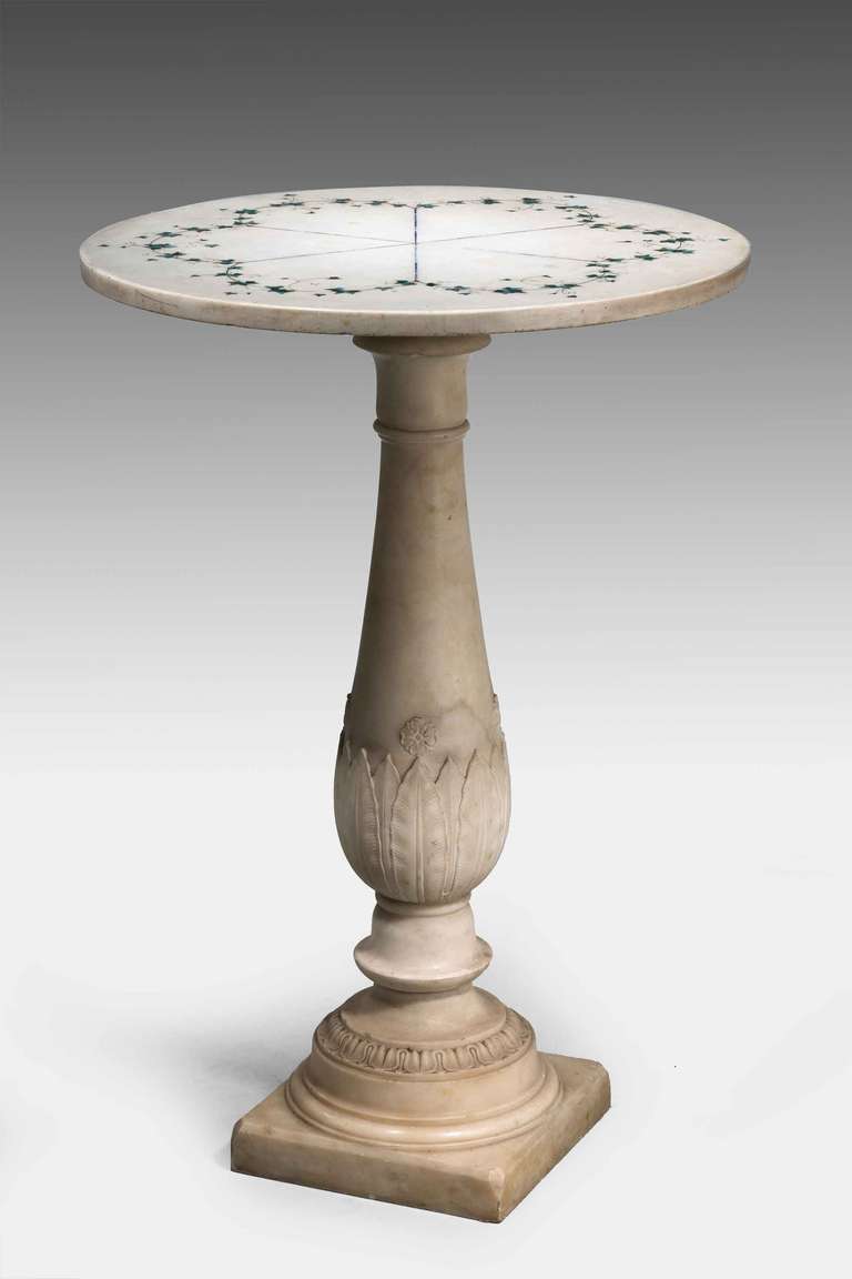 18th century well carved Carrara marble table, the base surmounted with a marble top delicately inlaid with ivy decoration, the base circa 1760 the top circa 1850.

