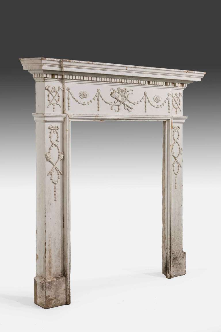Late 19th century small fire surround after a design by Robert Adam. 

Provenance:
By the 1800s most new fireplaces were made up of two parts, the surround and the insert. The surround consisted of the mantel piece and sides supports, usually in