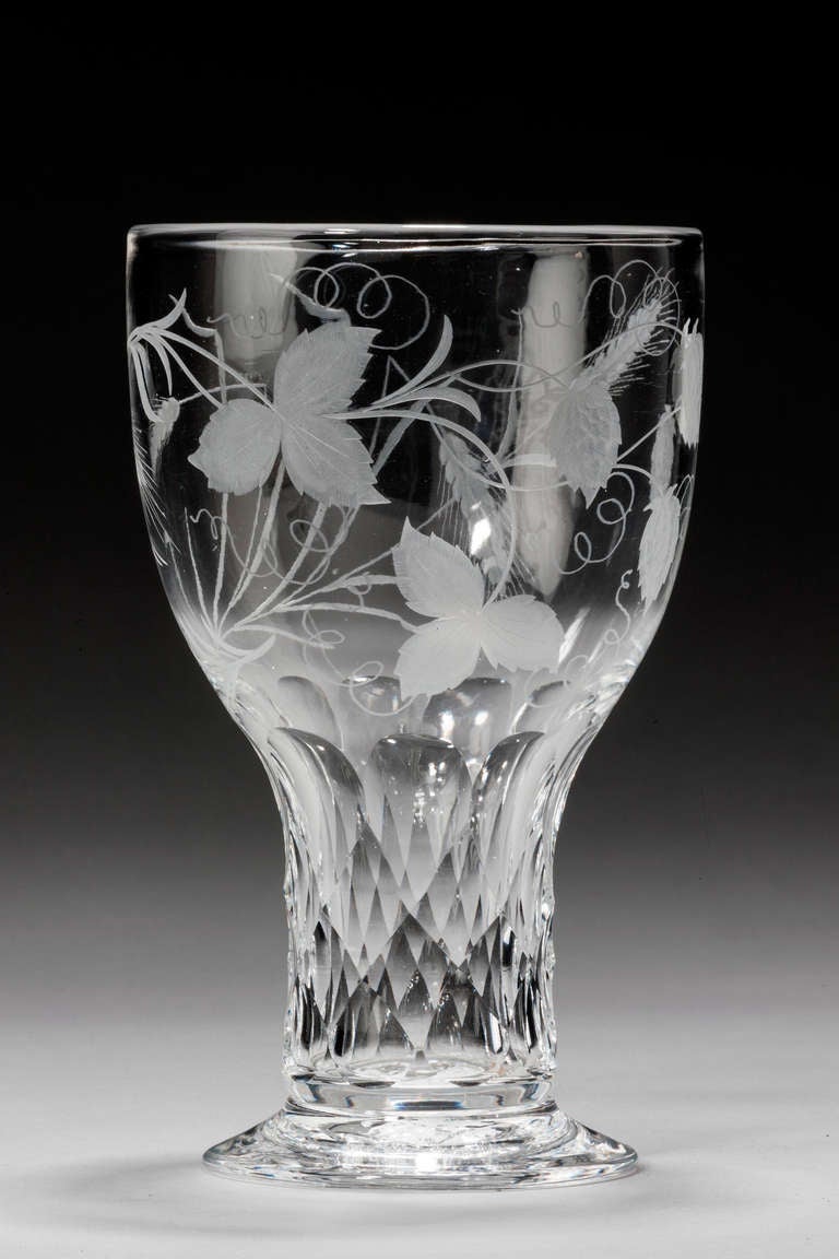 A large goblet with facet cut stem, the bowl with hop and barley engraving.

RR.