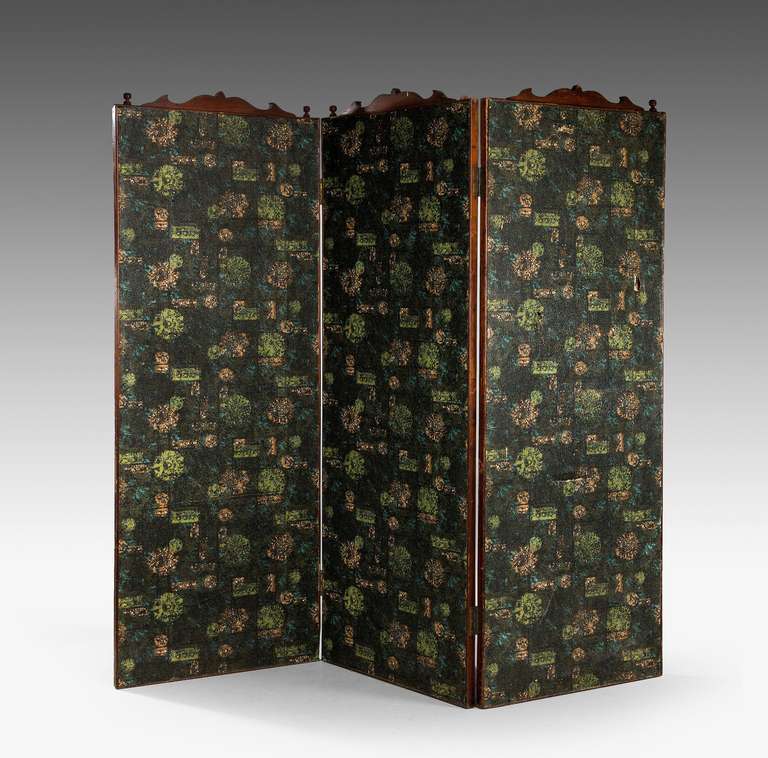 Three fold 19th century screen with mahogany outer frame, now covered in dreadful wallpaper.