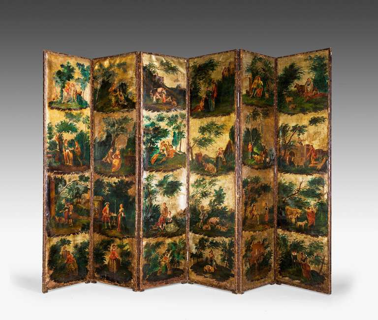 A good mid-18th century six fold screen on canvas with 24 oil painted panels of rural scenes on a soft gold background.
