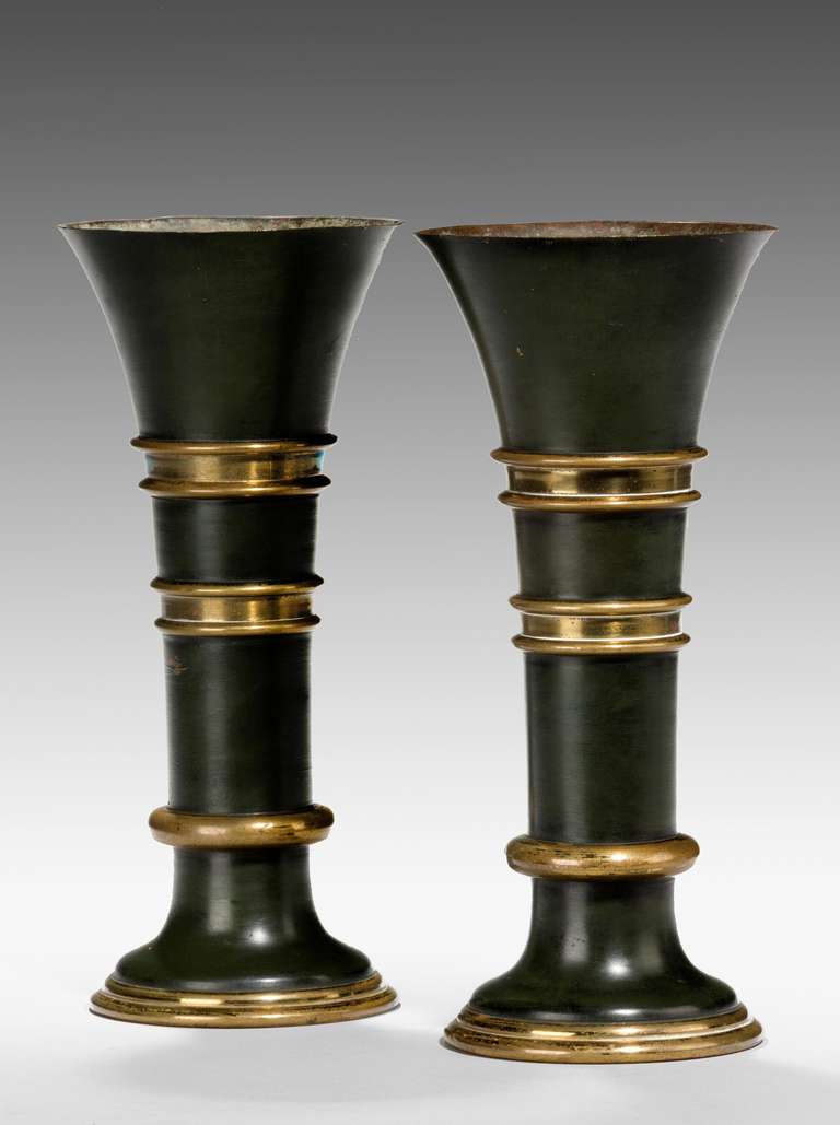 A pair of late 19th century flared bronze and gilt bronze vases, rich dark brown patina.