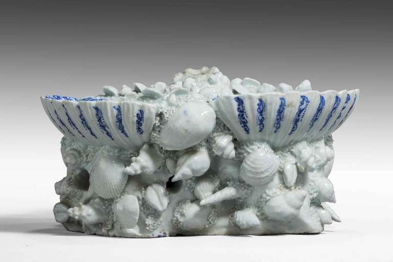 An attractive porcelain blue and white shell dish, with applied shells around the upper section with manufacturer cracks to two of the dishes.