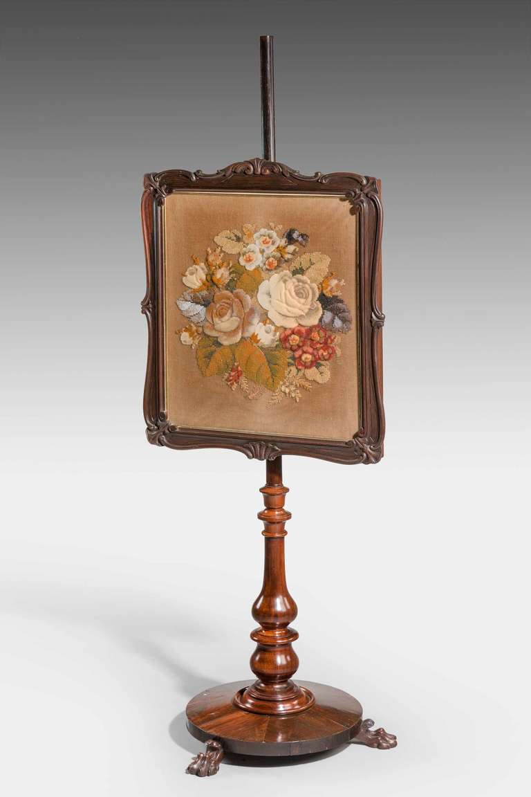 19th Century adjustable Pole Screen on three claw supports, the central panel with a Crossley's tapestry. 

Provenance
 John Crossley, was a carpet manufacturer at Dean Clough Mills, Halifax and died 17 January 1837, having had by his wife Martha,