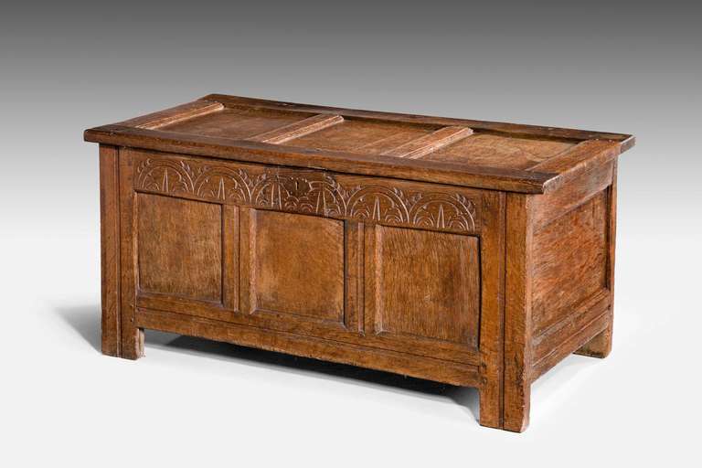 Early 18th century oak three-panel coffer with incised decoration to the top stile.