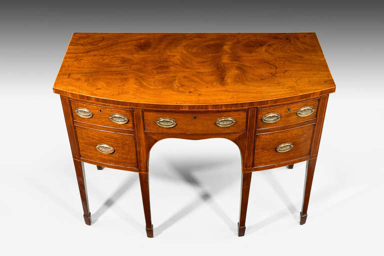 A late 18th century mahogany sideboard of small size, the top edge cross banded, the upper stiles with boxwood line inlay, square tapering supports over block feet.

Provenance
Sideboards are an item of furniture traditionally used in the dining
